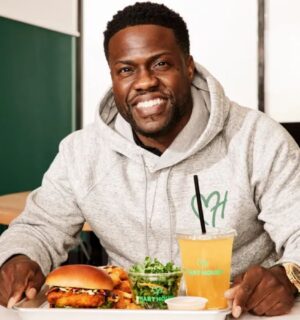 Plant-based celebrity Kevin Hart eating at Hart House, his vegan fast food restaurant chain