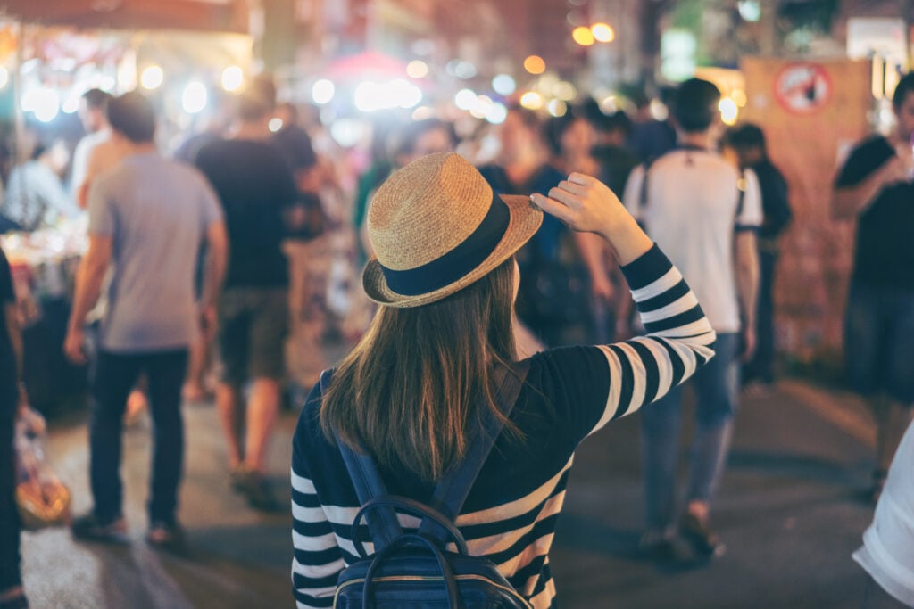 A visitor to a night time market in New York City's Central Park