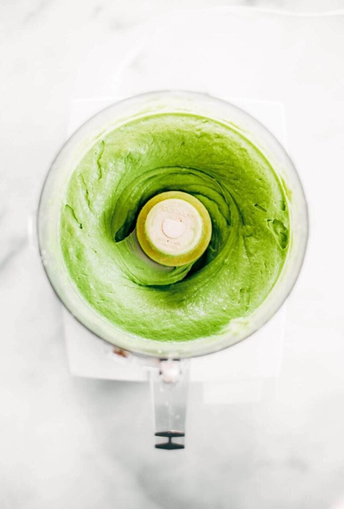 A blender full of avocado for a vegan key lime pie recipe