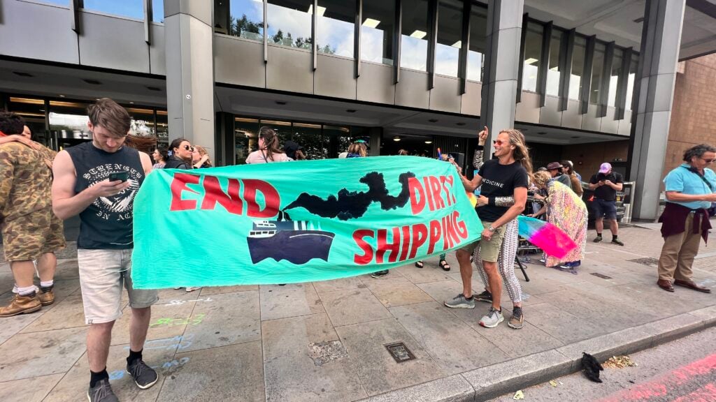 Activists holding a banner reading "end dirty shipping"