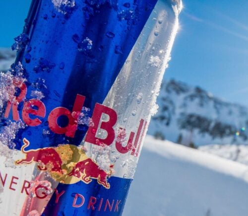 A can of Red Bull covered in ice