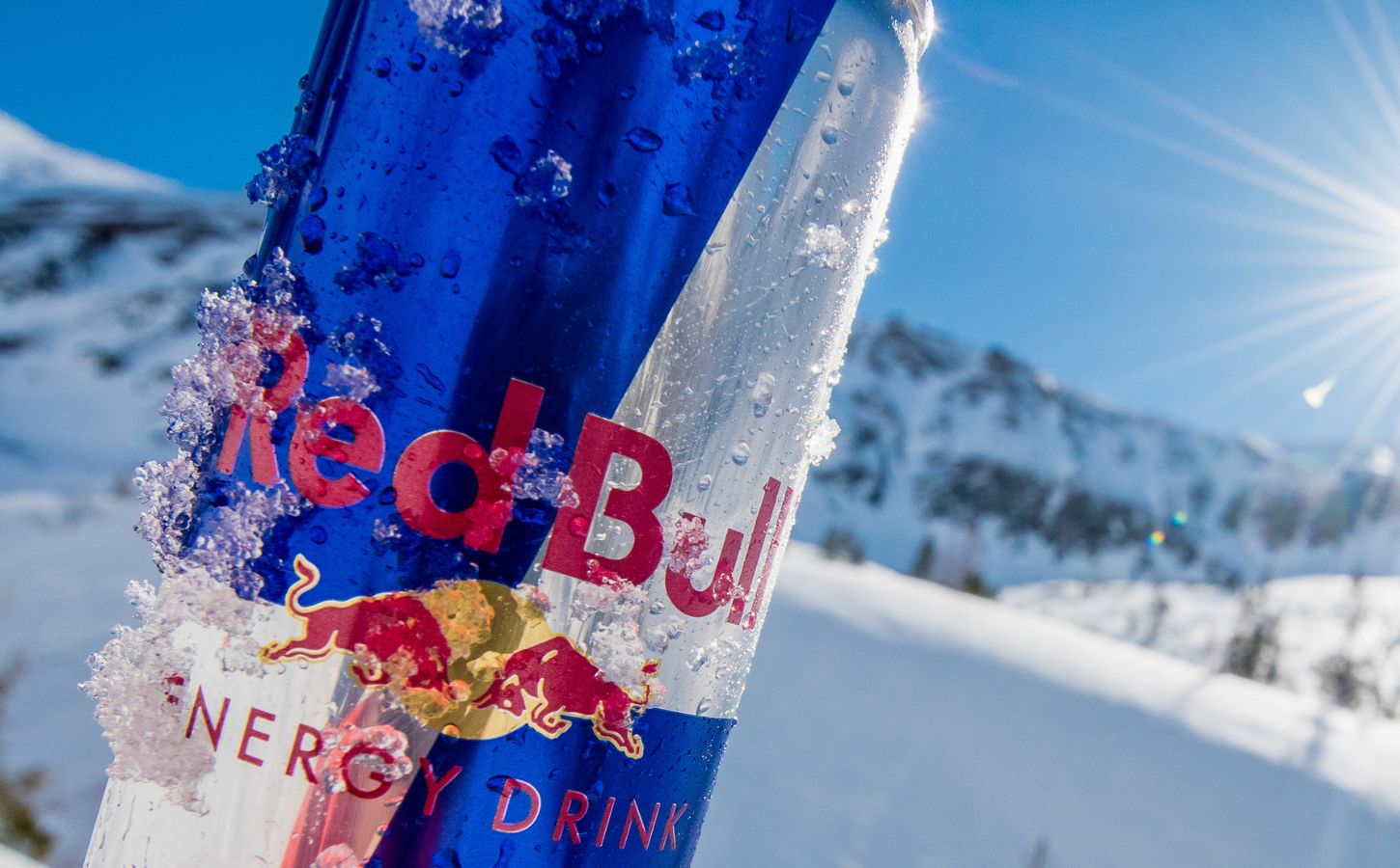 A can of Red Bull covered in ice