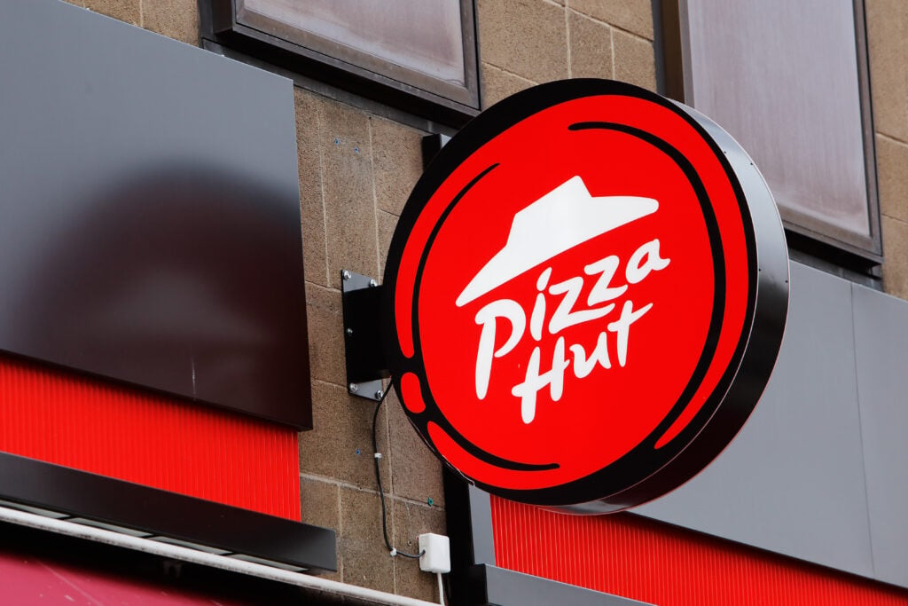 The outside sign of the vegan-friendly fast food restaurant Pizza Hut