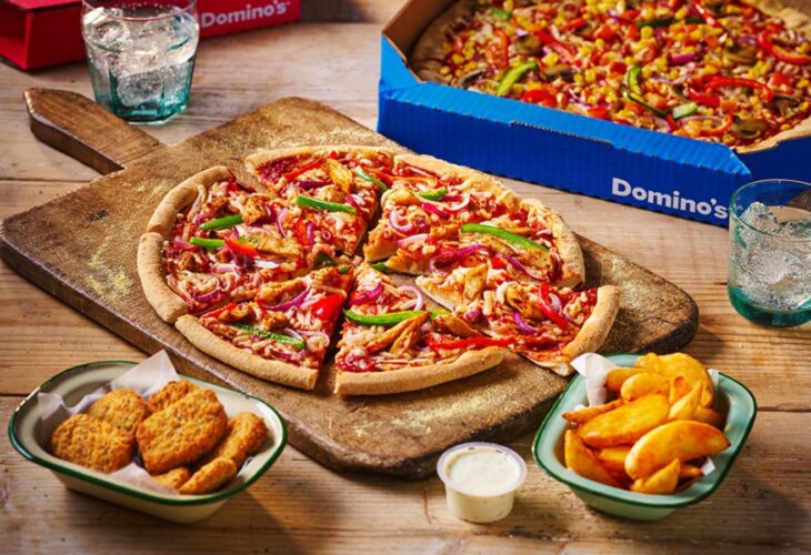 A vegan pizza and sides at Domino's, which are part of the pizza chain's plant-based menu
