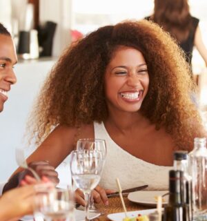 Friends eating dinner at a vegan-friendly restaurant