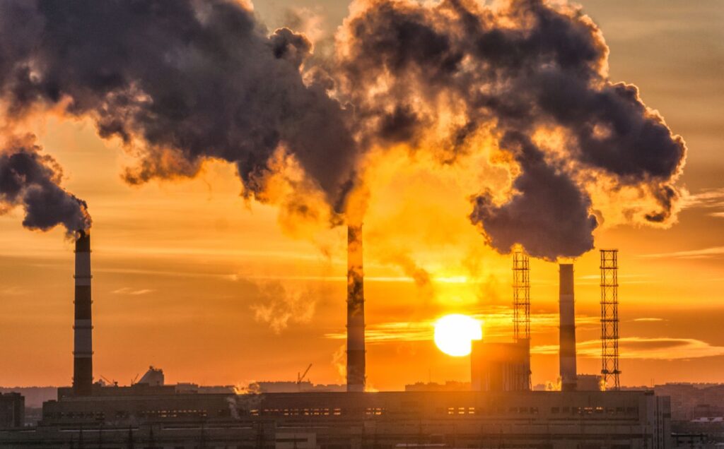 Fossil fuels burning in a factory, releasing environmentally damaging carbon