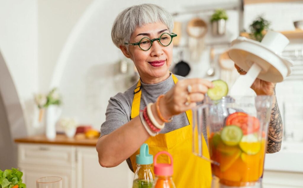 A woman making a plant-based smoothie