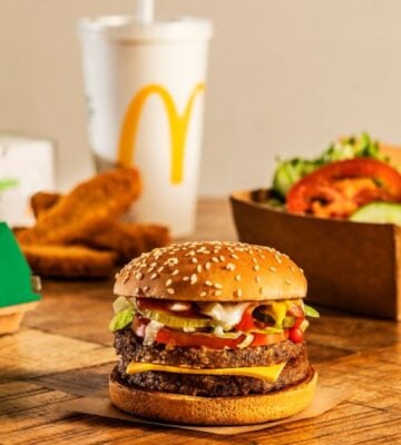 A selection of McDonald's vegan items, including a plant-based burger, drink, and salad, off the meat-free menu
