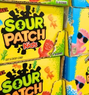 Sour patch kids, a non-vegan sweet containing gelatin, on the supermarket shelf