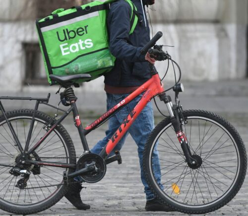 A delivery person for vegan-friendly takeaway service Uber Eats