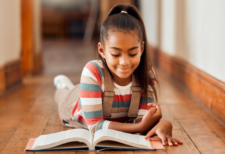 A child reading a vegan-friendly children's book