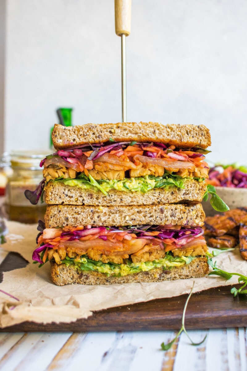 A vegan tempeh and apple slaw sandwich