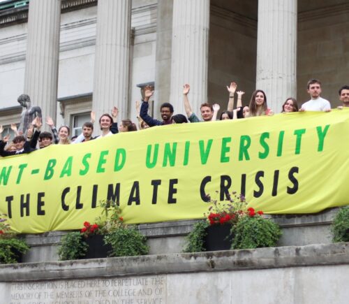 Students from the Plant-Based Universities campaign holding up a banner calling for vegan catering