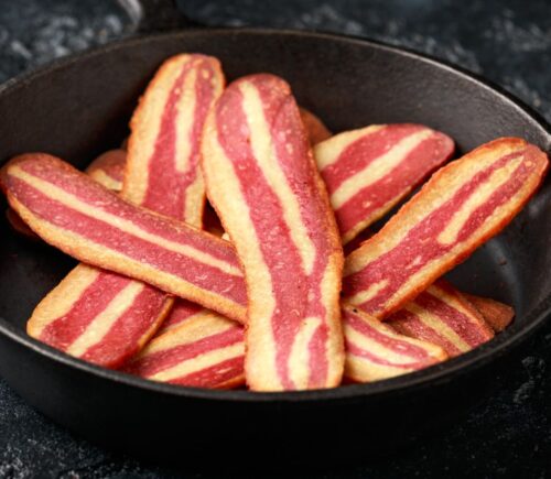 Vegan bacon being cooked in a a pan