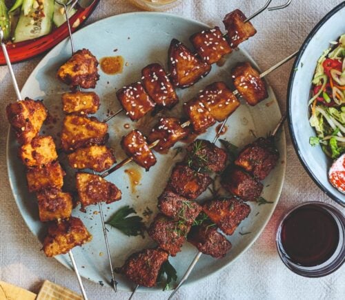 Vegan chicken skewers on a plate, a plant-based meat recipe from a new BOSH! cookbook