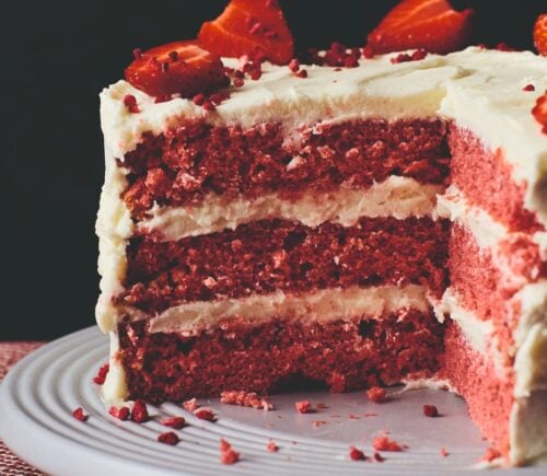 Close up shot of a vegan, dairy-free, and egg-free red velvet cake