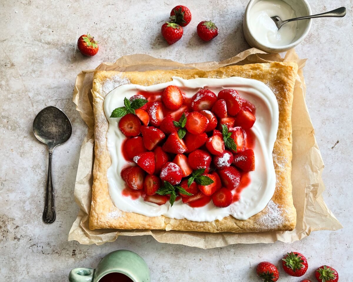 A vegan strawberry galette with dairy-free whipped cream