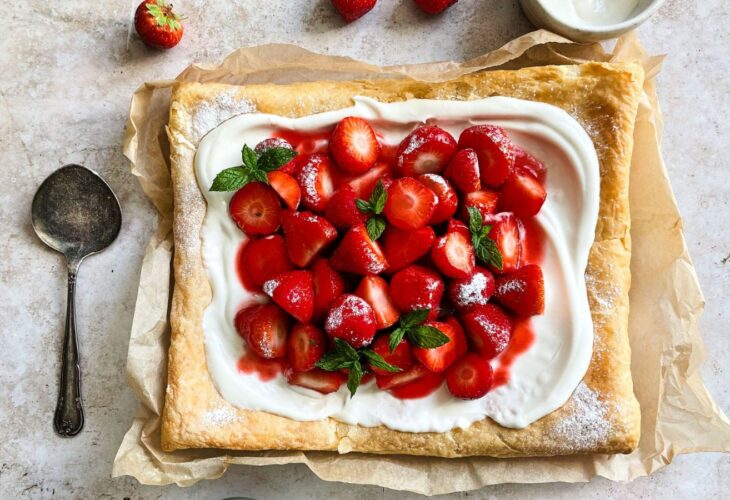 A vegan strawberry galette with dairy-free whipped cream