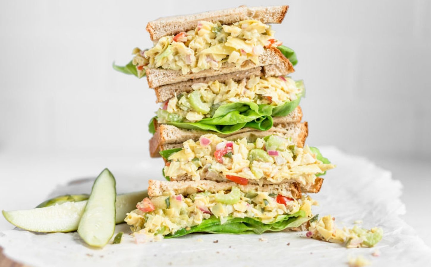 A vegan tuna salad sandwich featuring artichoke as a substitute for fish