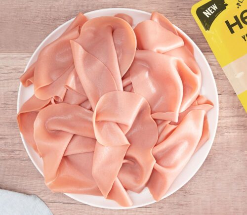 Heura's new cold cut additive-free vegan ham slices on a plate