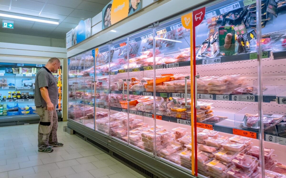 A Lidl Germany customer looking at the meat aisle