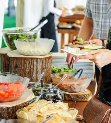 A person serving themselves vegan food at work