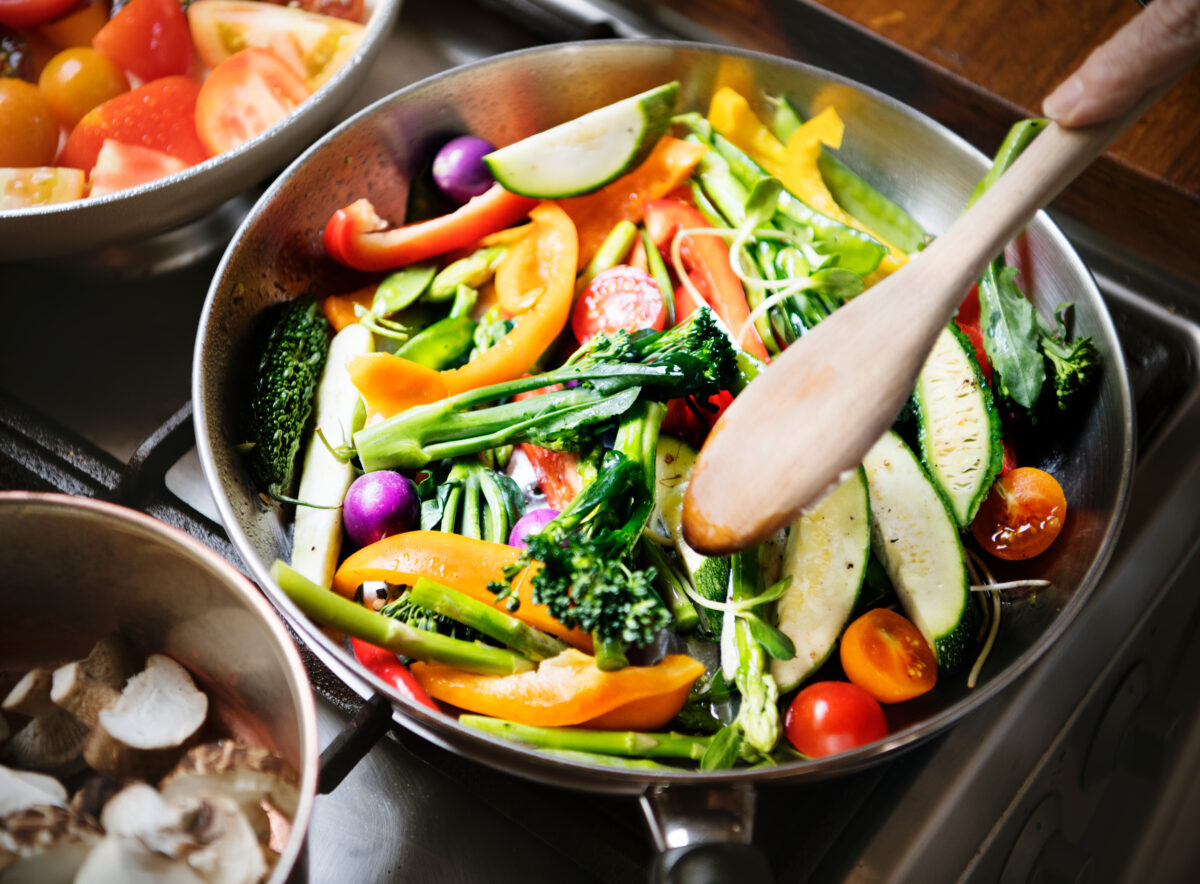 aerial shot of plant-based food, which has been shown to protect against allergies, cooking in a pan