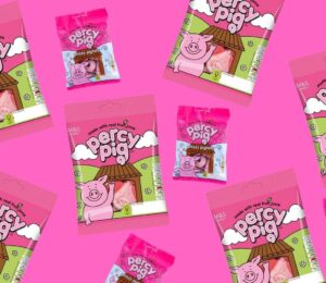 Packets of Percy Pigs on a pink background