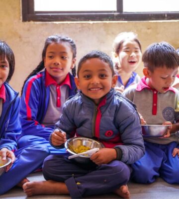 Children receiving vegan meals from Food For Life