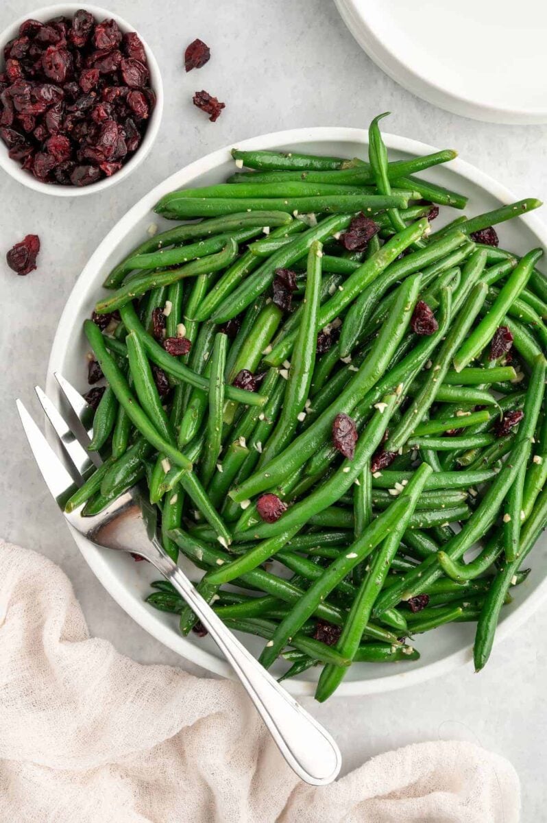 A vegan green bean recipe with garlic and cranberries