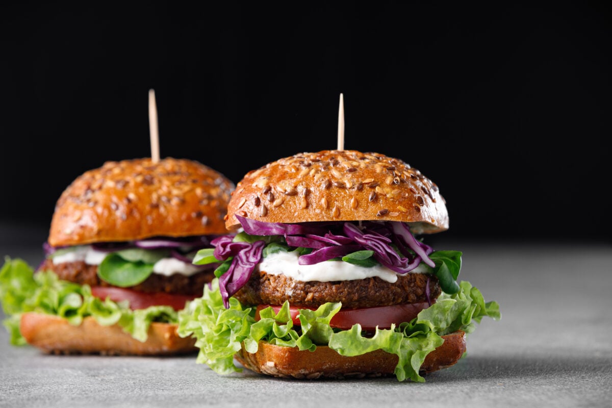 Artistic photo of an ultra-processed plant-based burger,