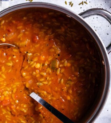 A vegan soup made with orzo pasta