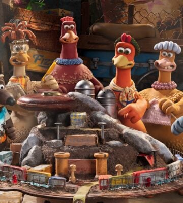 Chicken Run 2 characters look at model of Fun-Land Farms