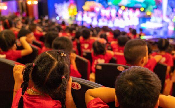 Children in the audience of a stage show