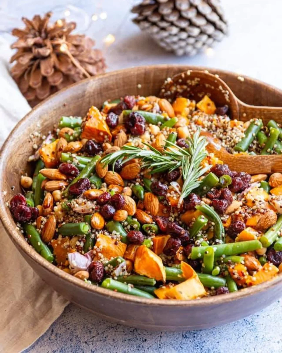 Photo shows a hearty vegan Christmas salad featuring green beans and sweet potato.