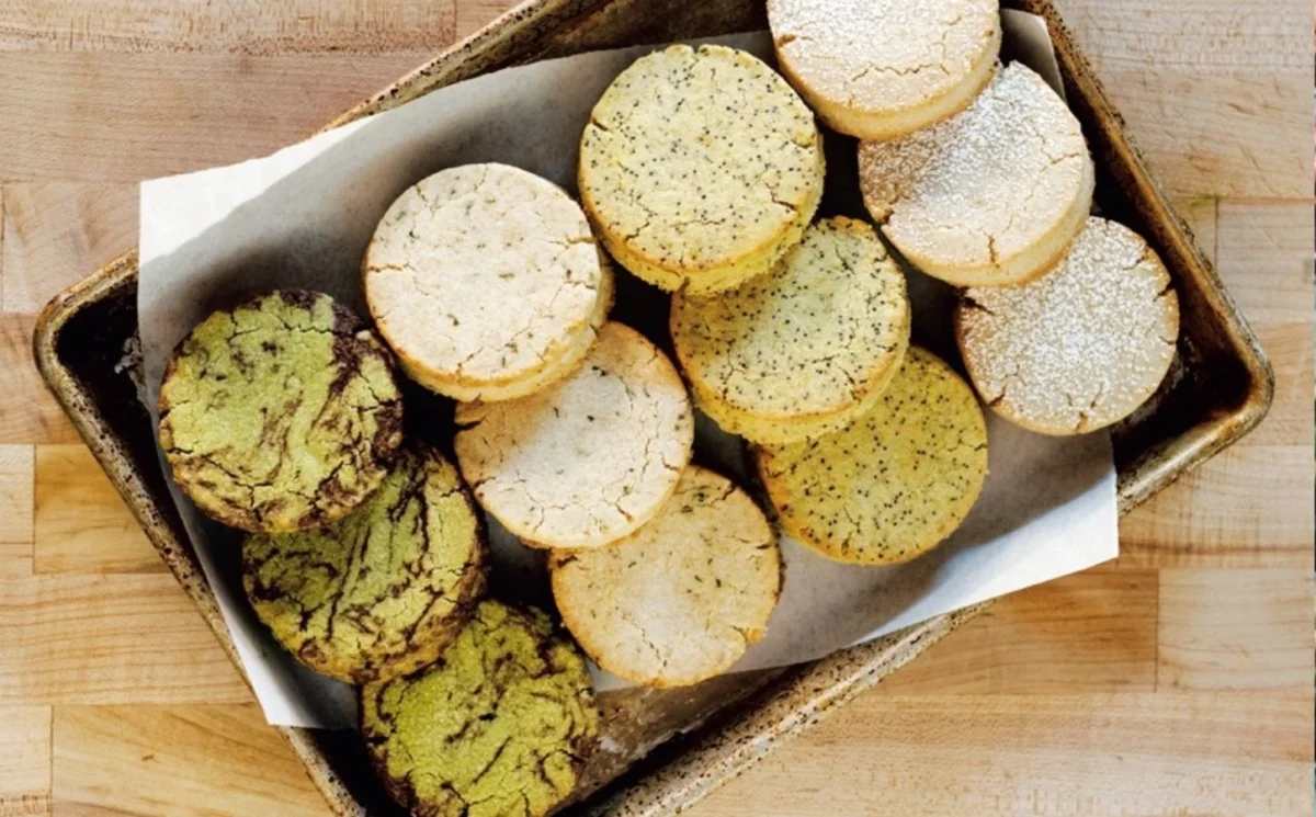 Photo shows a tray of circular Scottish-style shortbread adapted for a vegan recipe.