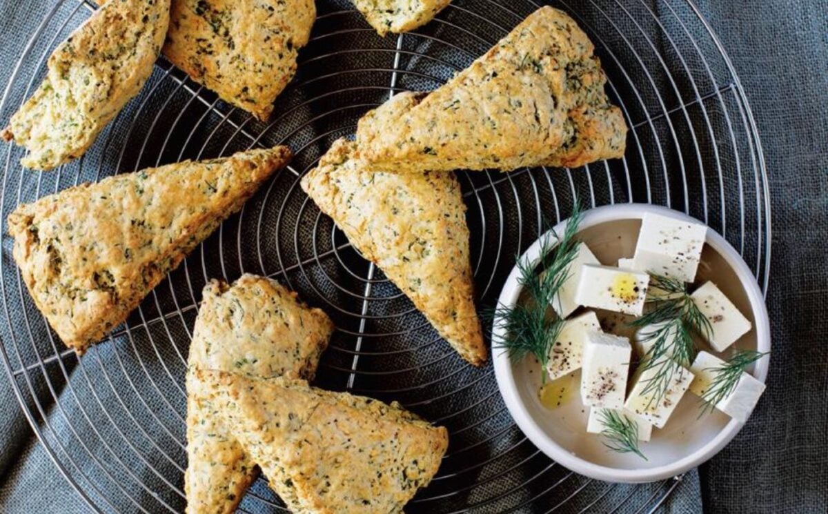 A tray of vegan herb scones with a side of macadamia feta
