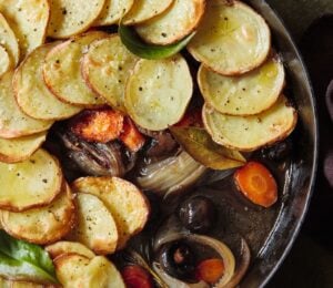 A one-pot mushroom pie with sliced potato layered on top