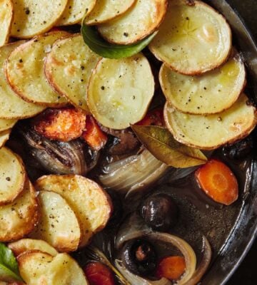 A one-pot mushroom pie with sliced potato layered on top