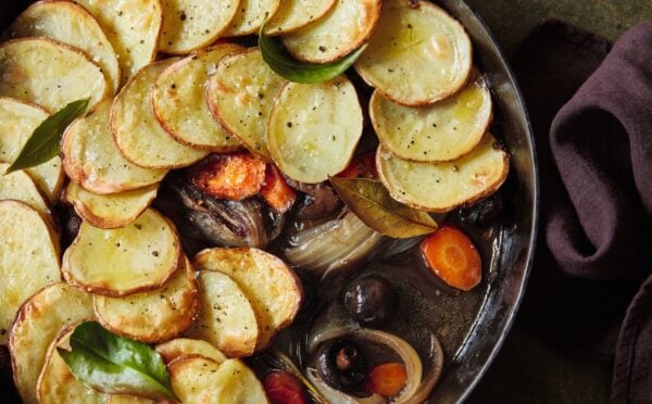 A one-pot mushroom pie with sliced potato layered on top