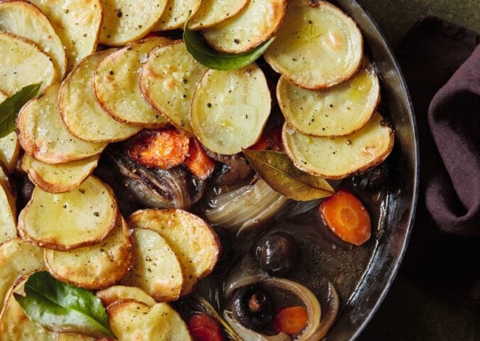 A one-pot mushroom pie with sliced potato layered on top