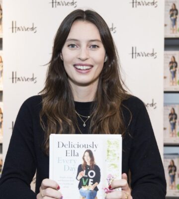 Deliciously Ella with one of her plant-based books