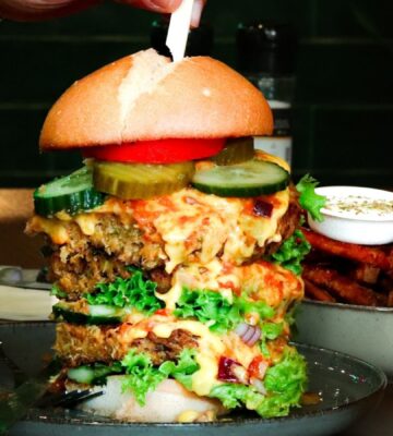 A massive burger stack at Happy Food and Health in Rotterdam, one of HappyCow's top 10 best vegan restaurants