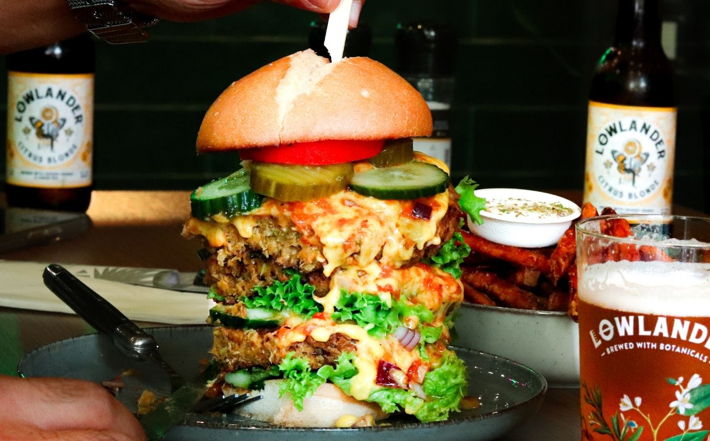 A massive burger stack at Happy Food and Health in Rotterdam, one of HappyCow's top 10 best vegan restaurants