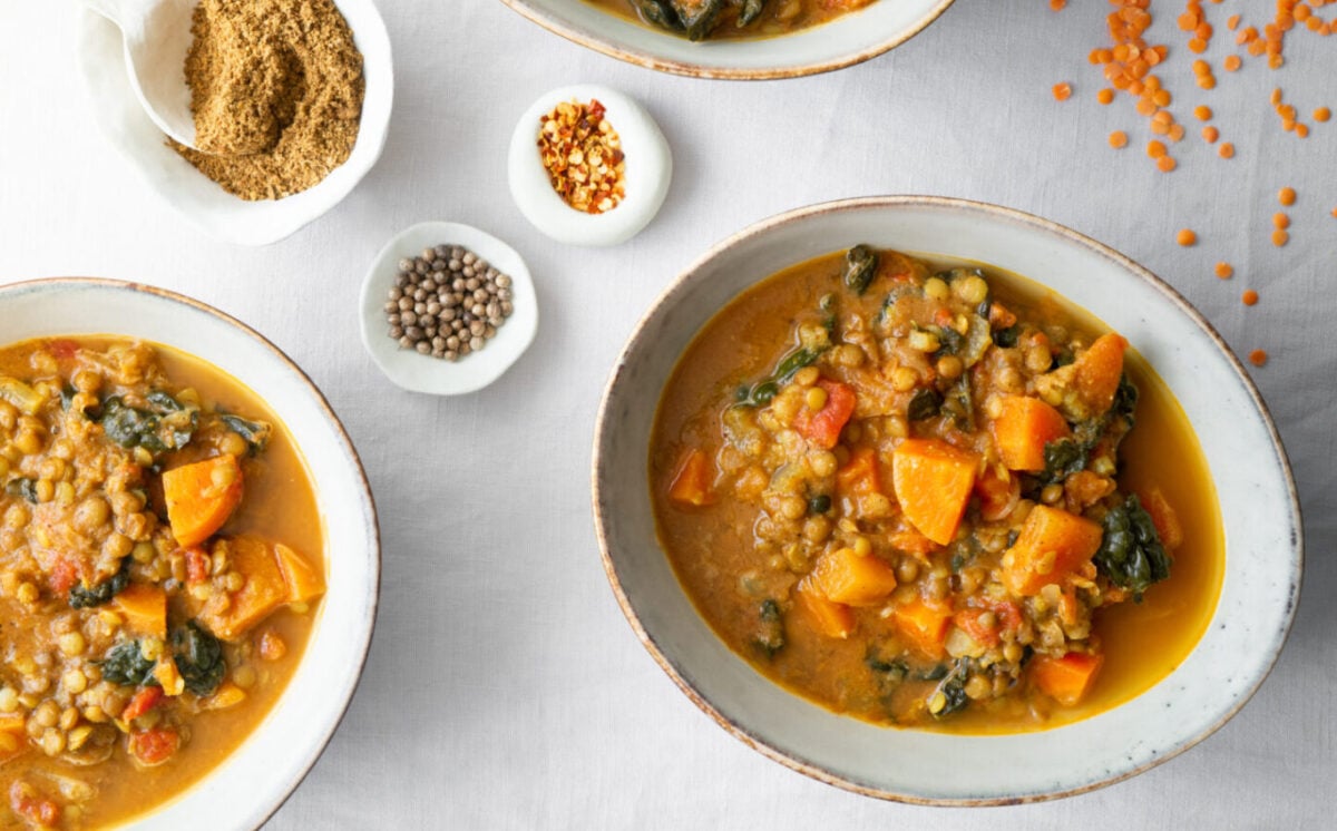 Photo shows several dishes of a lentil stew cooked simply in one pot.