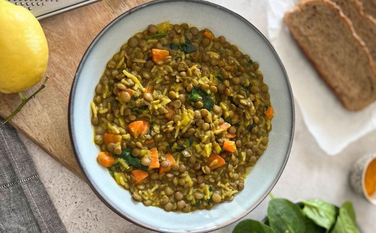 Photo shows a bowl of turmeric and ginger lentil stew.