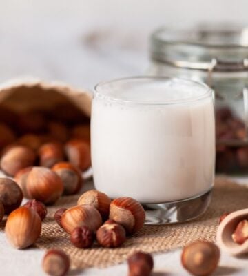 Artistic photo of hazelnut milk, after a study showed swapping dairy to nuts has better outcomes for heart health