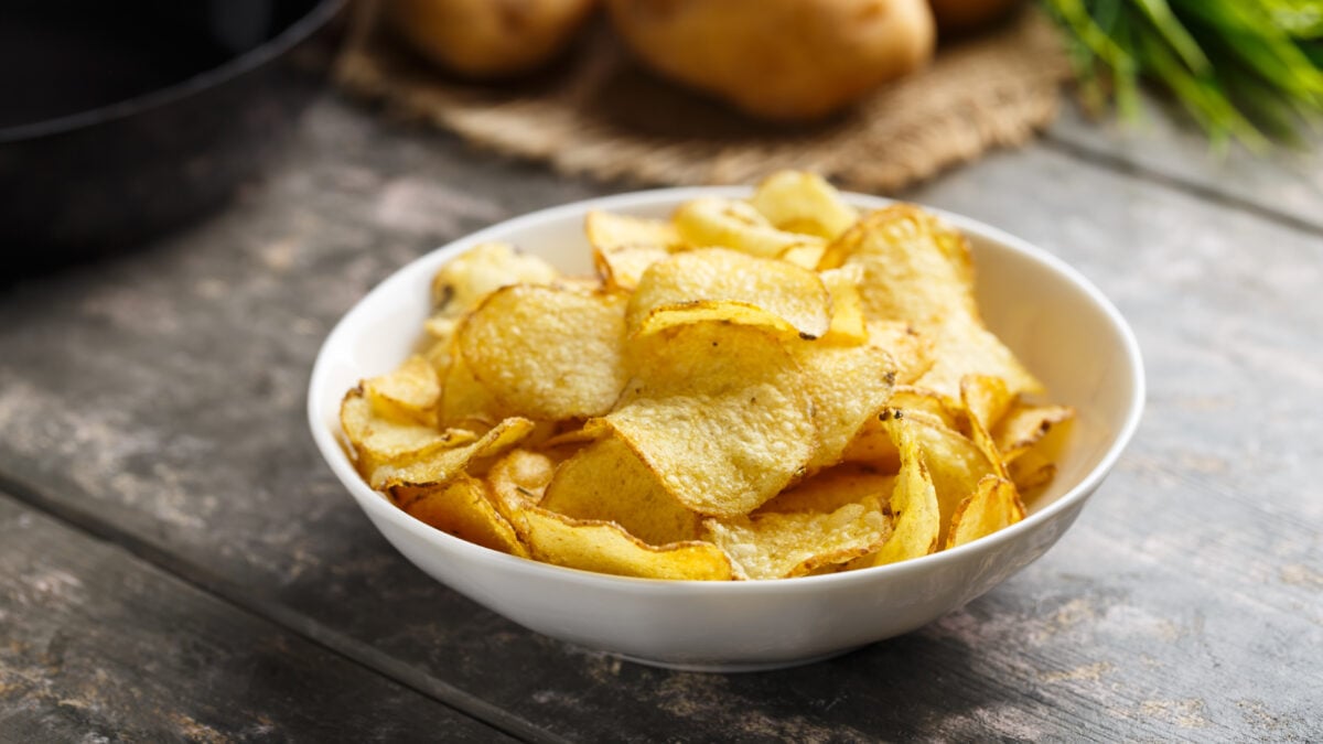 A bowl of vegan crisps, as Walkers announces the launch of three flavors for Veganuary 2024