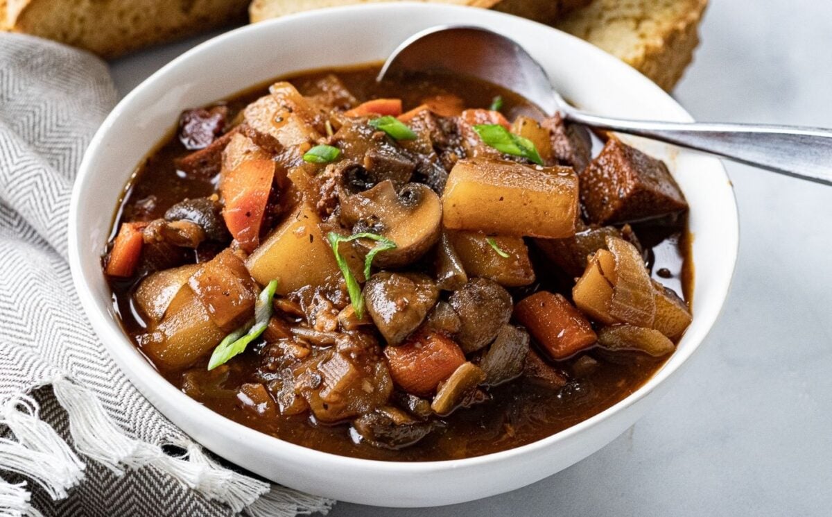 A bowl of vegan beef stew made with plant-based ingredients