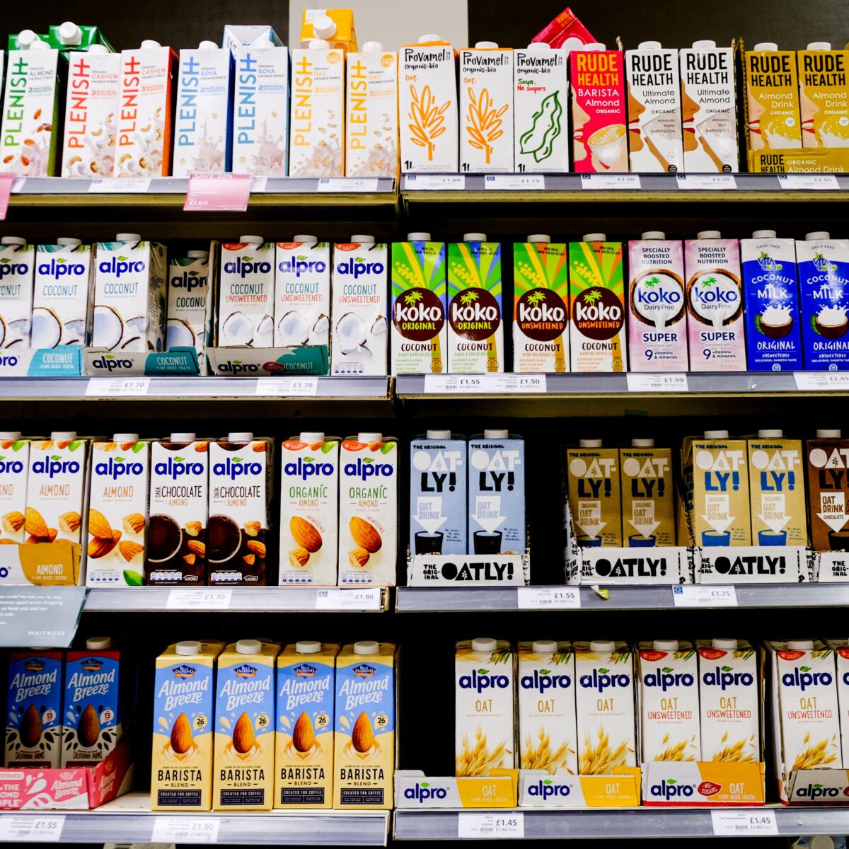 A selection of plant-based milks at the supermarket, including oat milk, which has been criticized for being unhealthy and bad for the environment